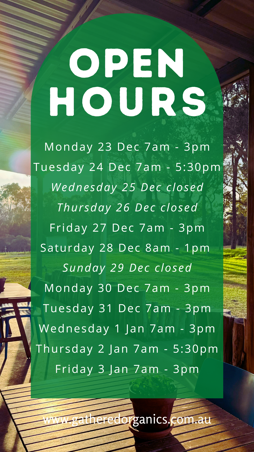 Green rounded-rectangle overlay reading “OPEN HOURS” with a list of dates and times from Monday 23 Dec to Friday 3 Jan (including several “closed” days). Background shows a covered outdoor seating area with wooden tables and chairs overlooking a grassy field with trees.
